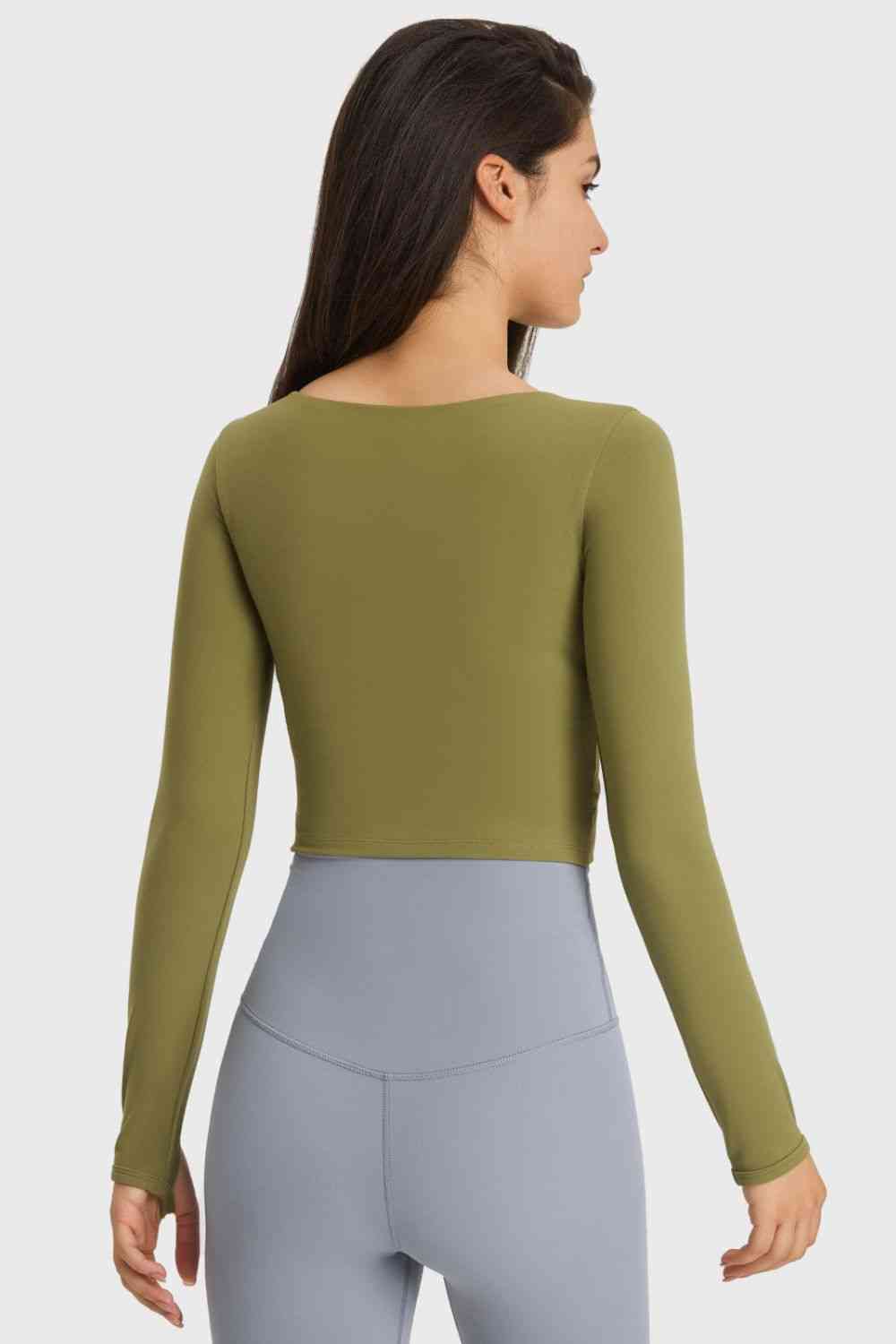 Millennia Cutout Long Sleeve Cropped Sports Top - FitFemme.Shop