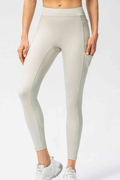 Full Size Slim Fit High Waist Long Sports Pants with Pockets - FitFemme.Shop