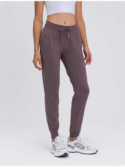 Millennia Double Take Tied Joggers with Pockets - FitFemme.Shop