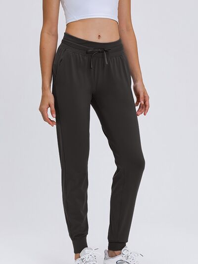 Millennia Double Take Tied Joggers with Pockets - FitFemme.Shop