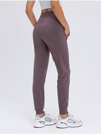 Millennia Double Take Tied Joggers with Pockets - FitFemme.Shop